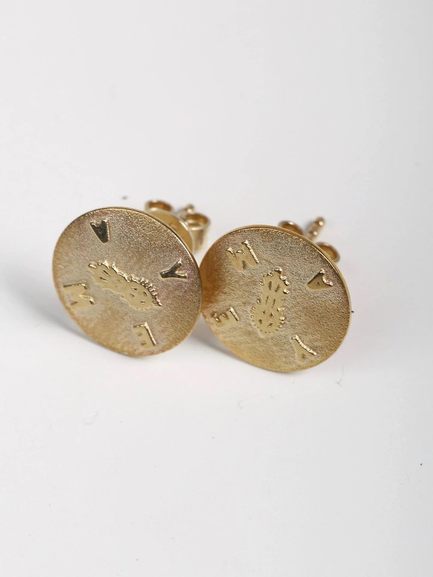 Luxury gold stud earrings with meskel cross motif. 9k real gold with convex design and matte finish. 0.4" diameter, delicate studs. $400. Free shipping $300+.