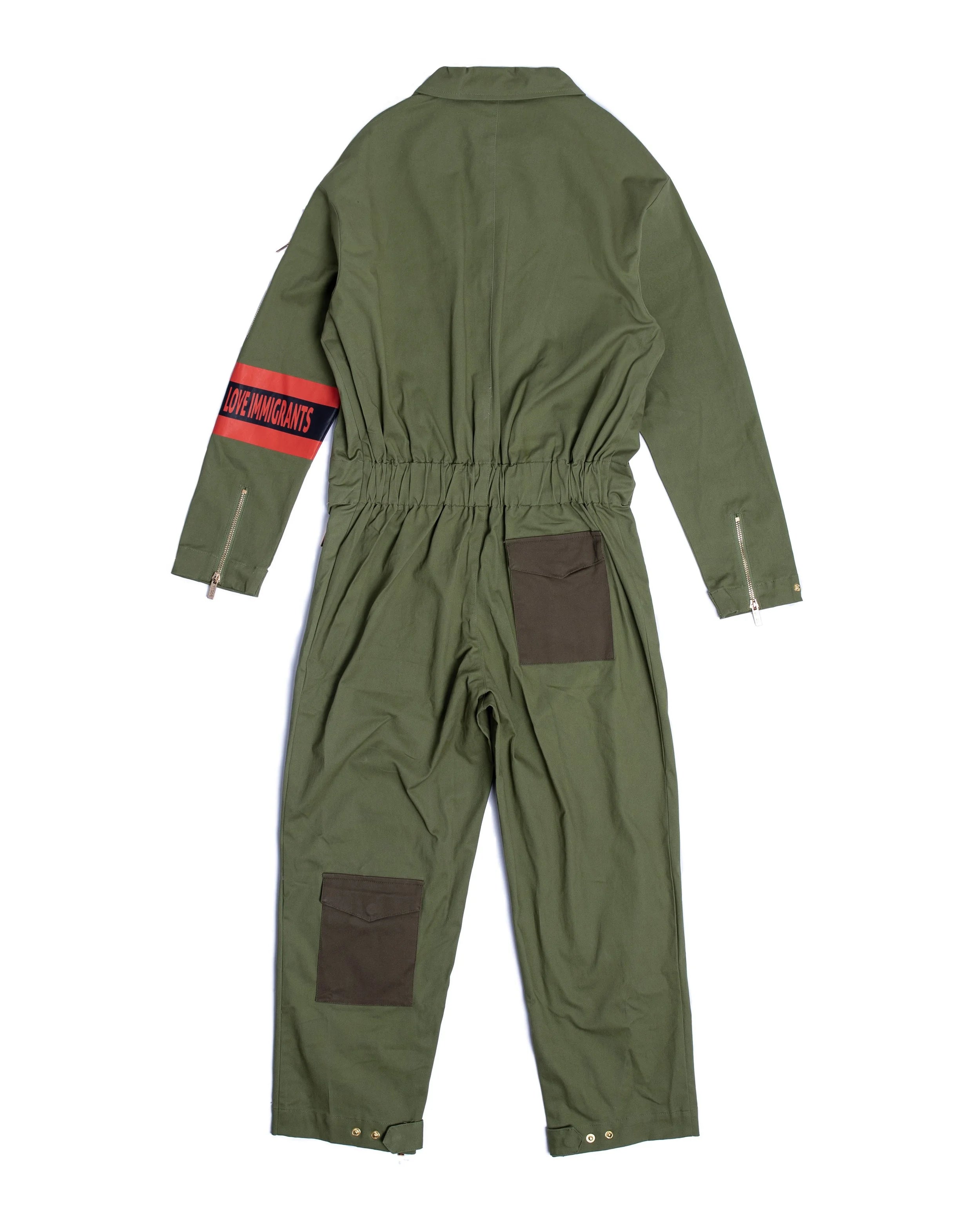 Premium cotton utility jumpsuit showing ample pockets and elevated design in earth tones