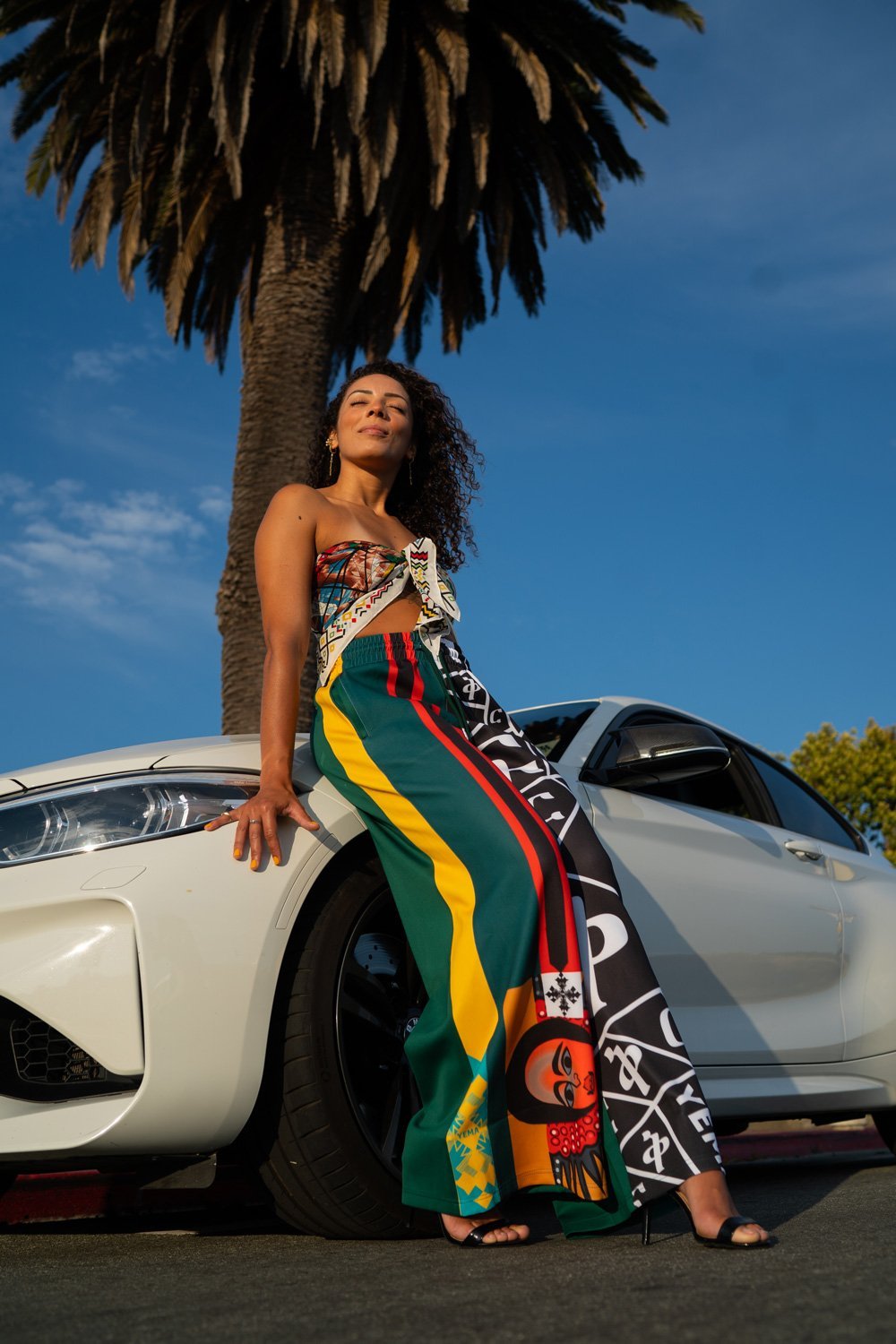 Side view of Jill Hamer pants in Addis Green with loose, travel-friendly fit and heritage design