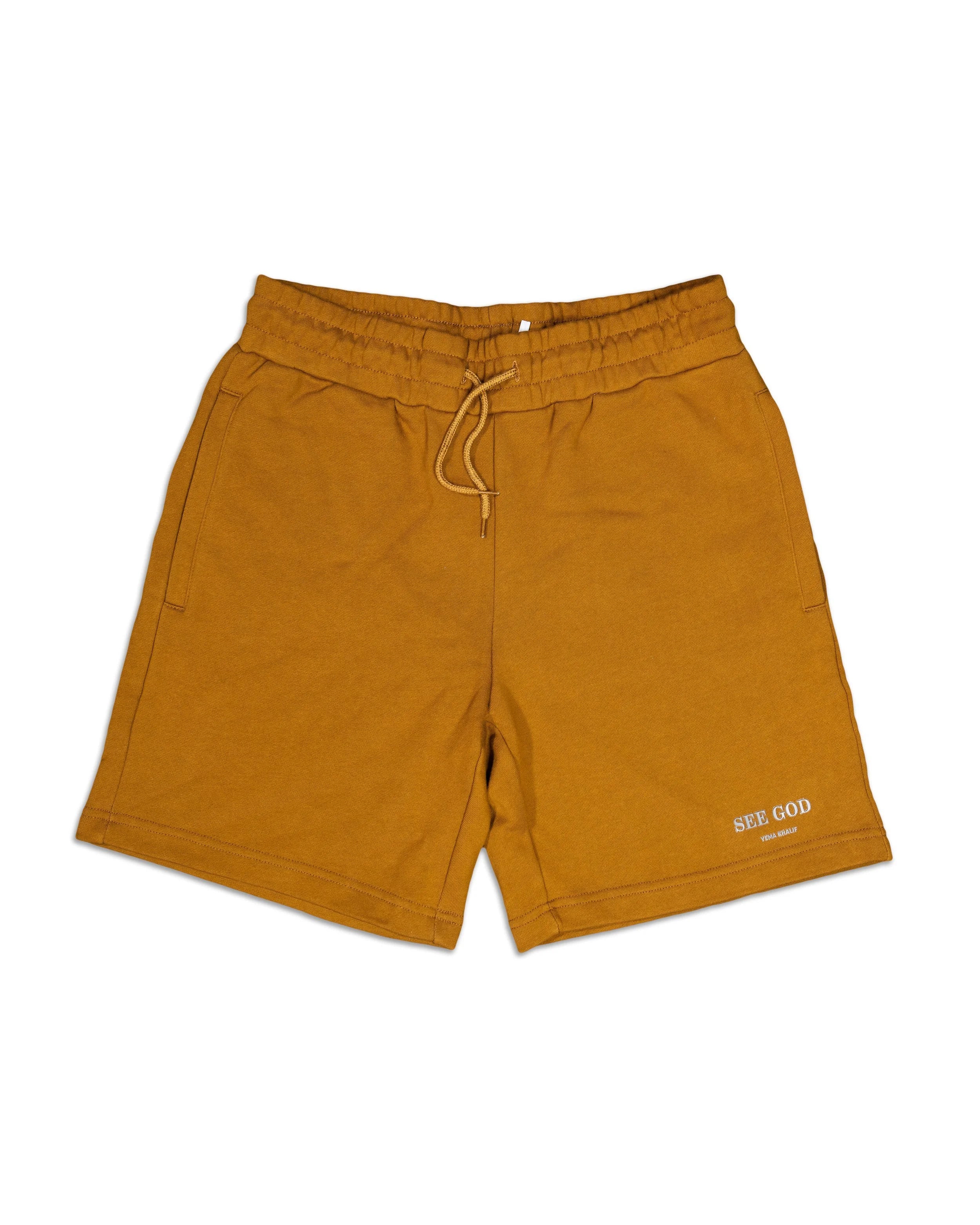 SEE GOD shorts in caramel ochre featuring signature logo and 100% cotton construction