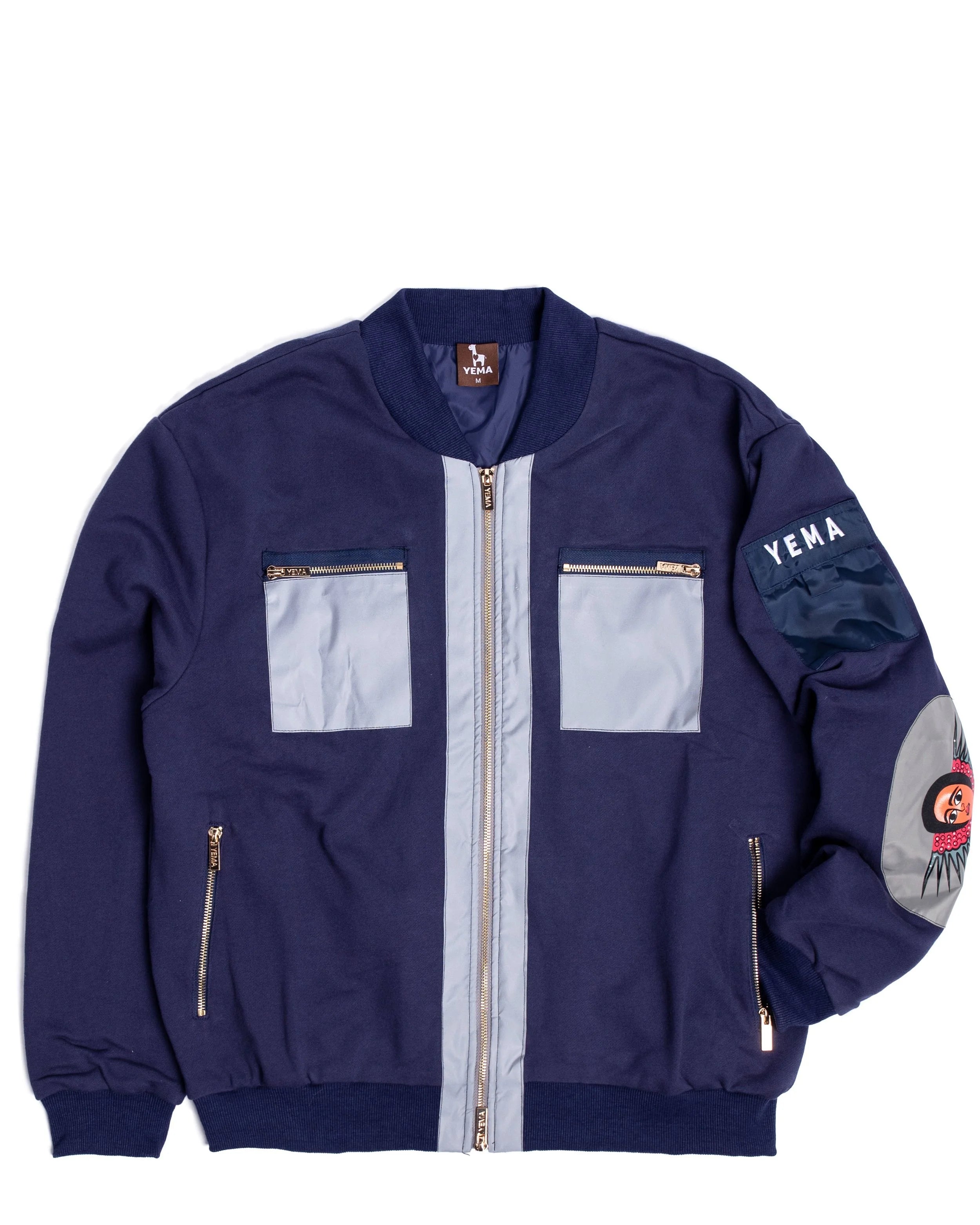 Front view of YEMA bomber showing reflective pockets that form X pattern when hit by light