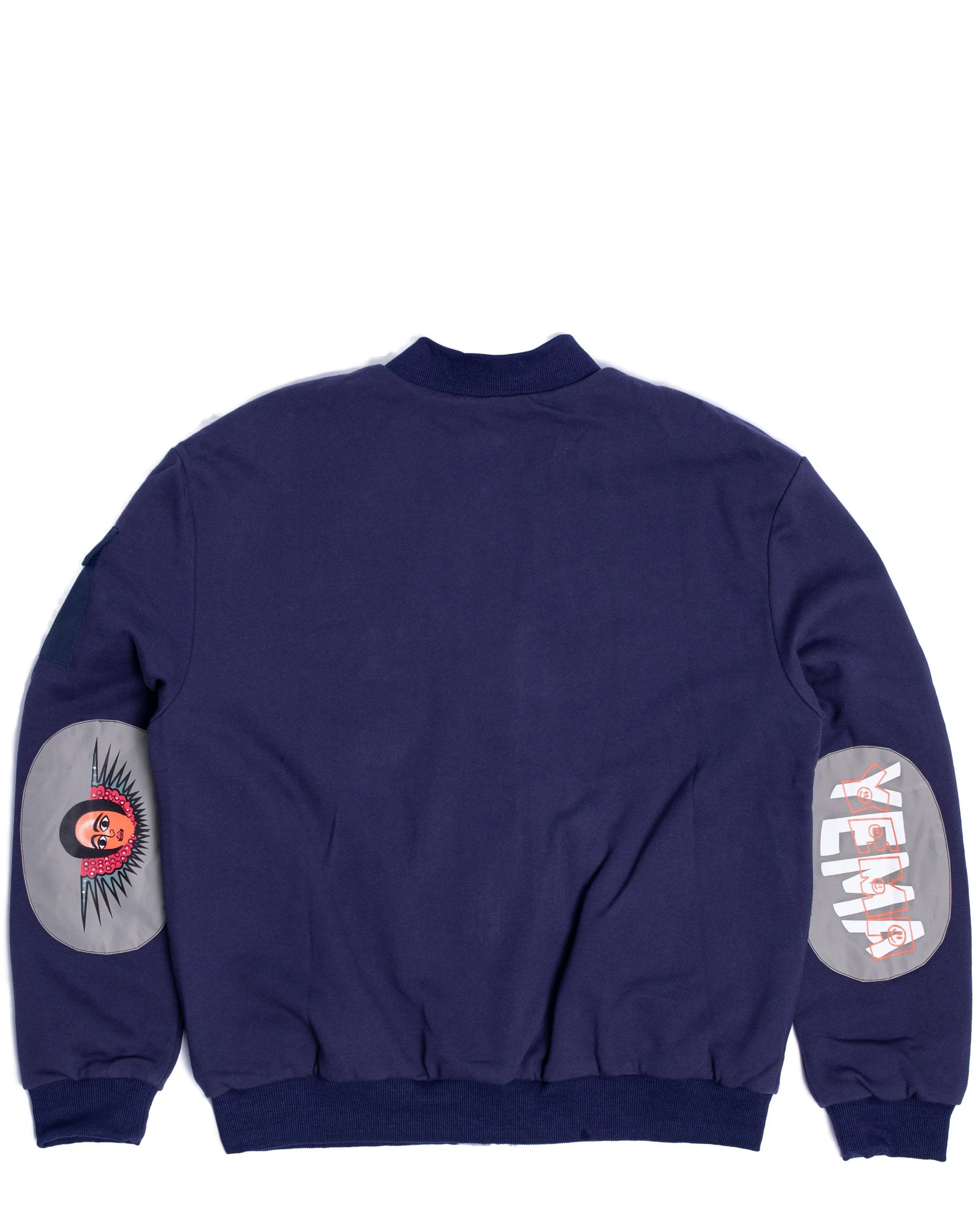 YEMA Bikila Kicha bomber jacket featuring reflective X detail and Abyssinian angel elbow patches