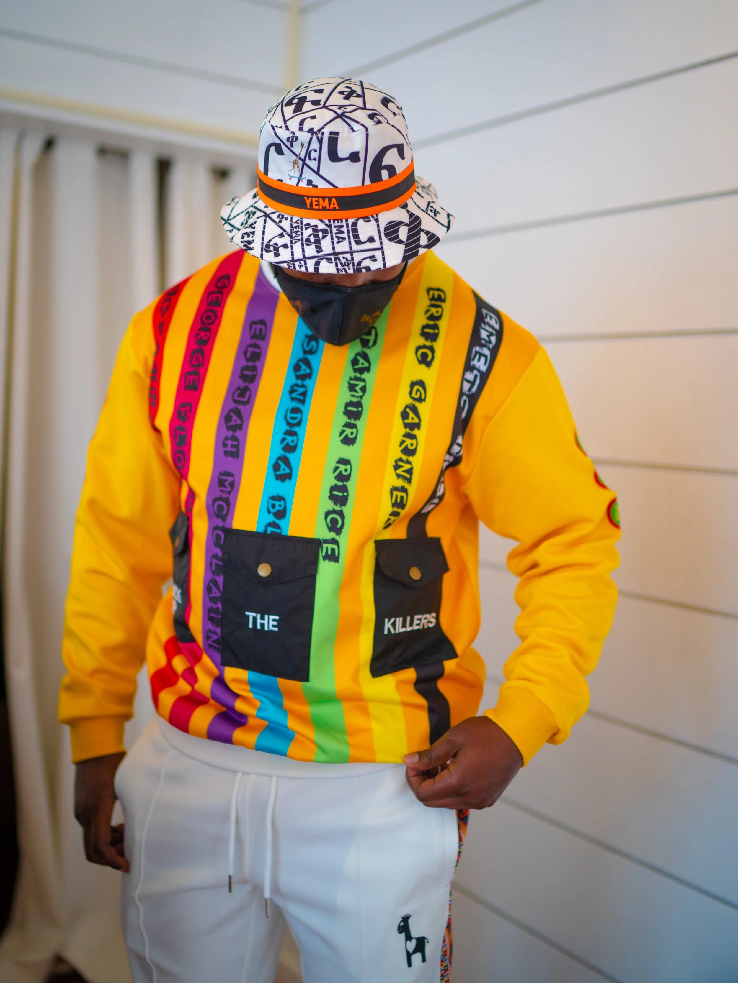 Top view of bucket hat honoring Abebe Bikila with FIKIR love pattern throughout