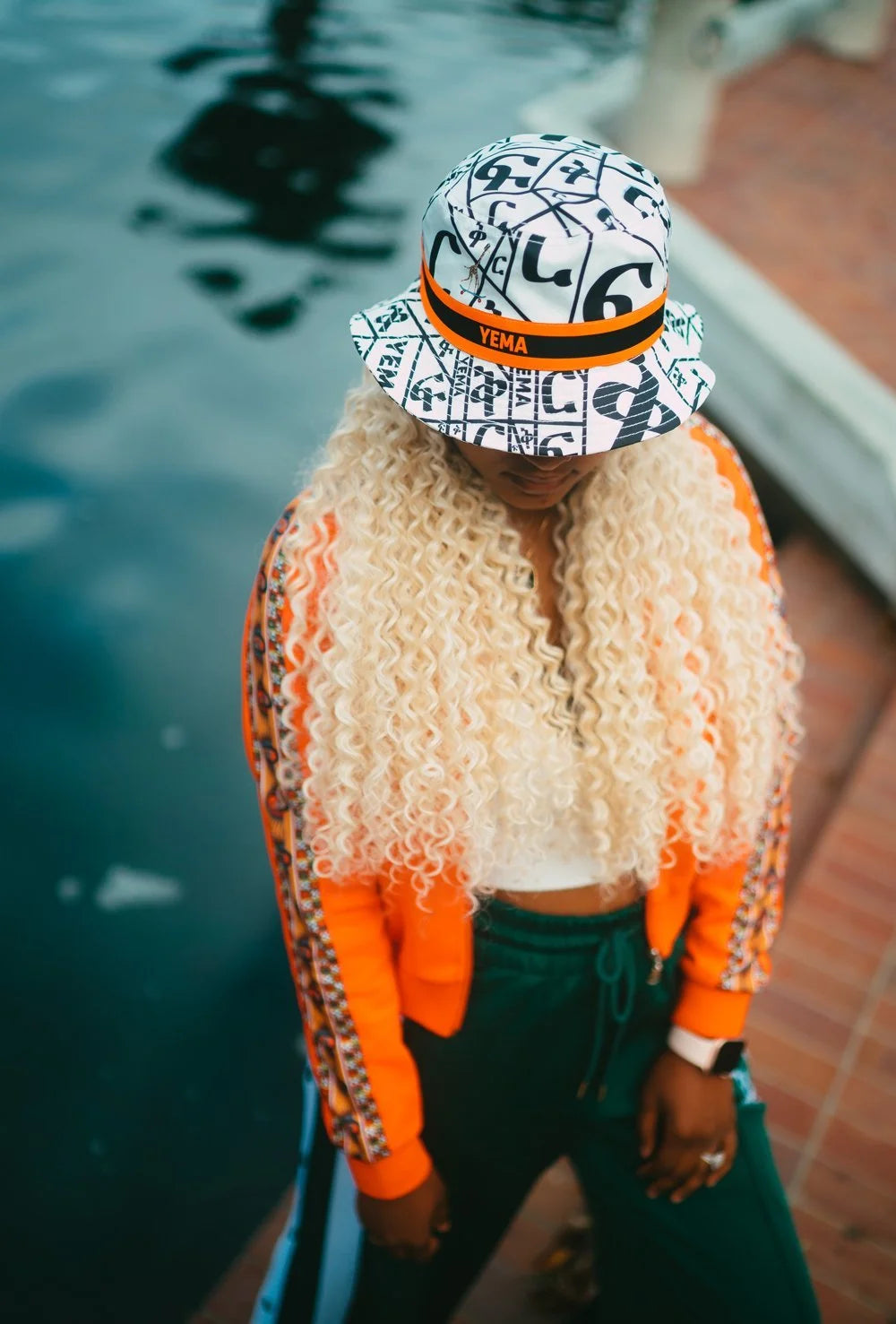 Top view of bucket hat honoring Abebe Bikila with FIKIR love pattern throughout