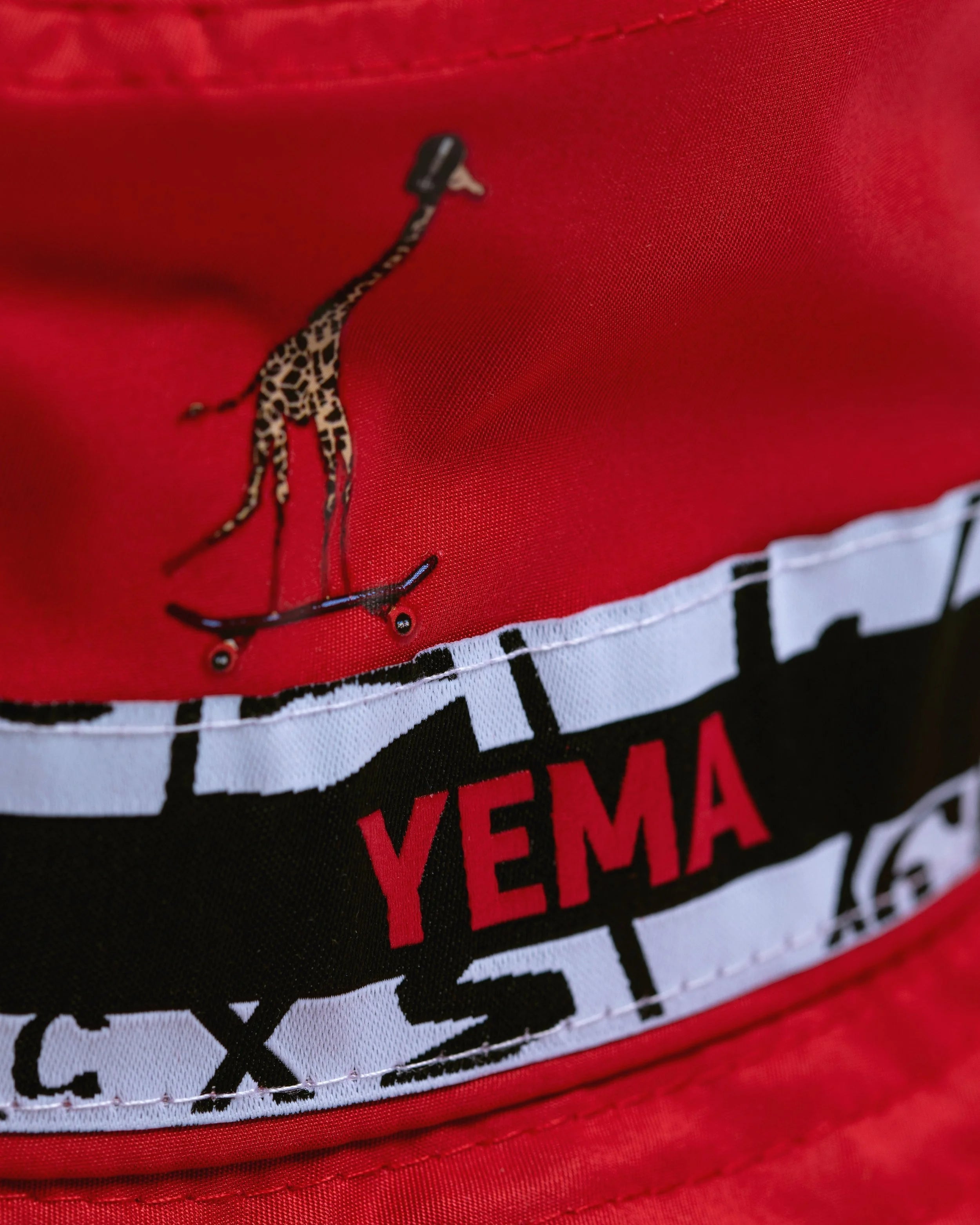 Premium bucket hat with cotton lining showing Ethiopian heritage giraffe design