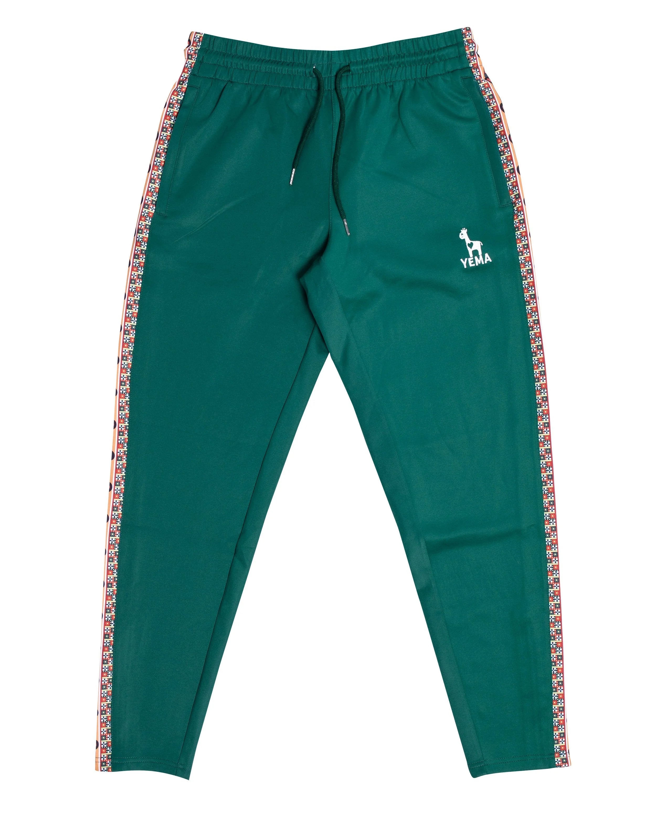YEMA Classic track pants in Addis Green featuring 17th century Abyssinian angels motif