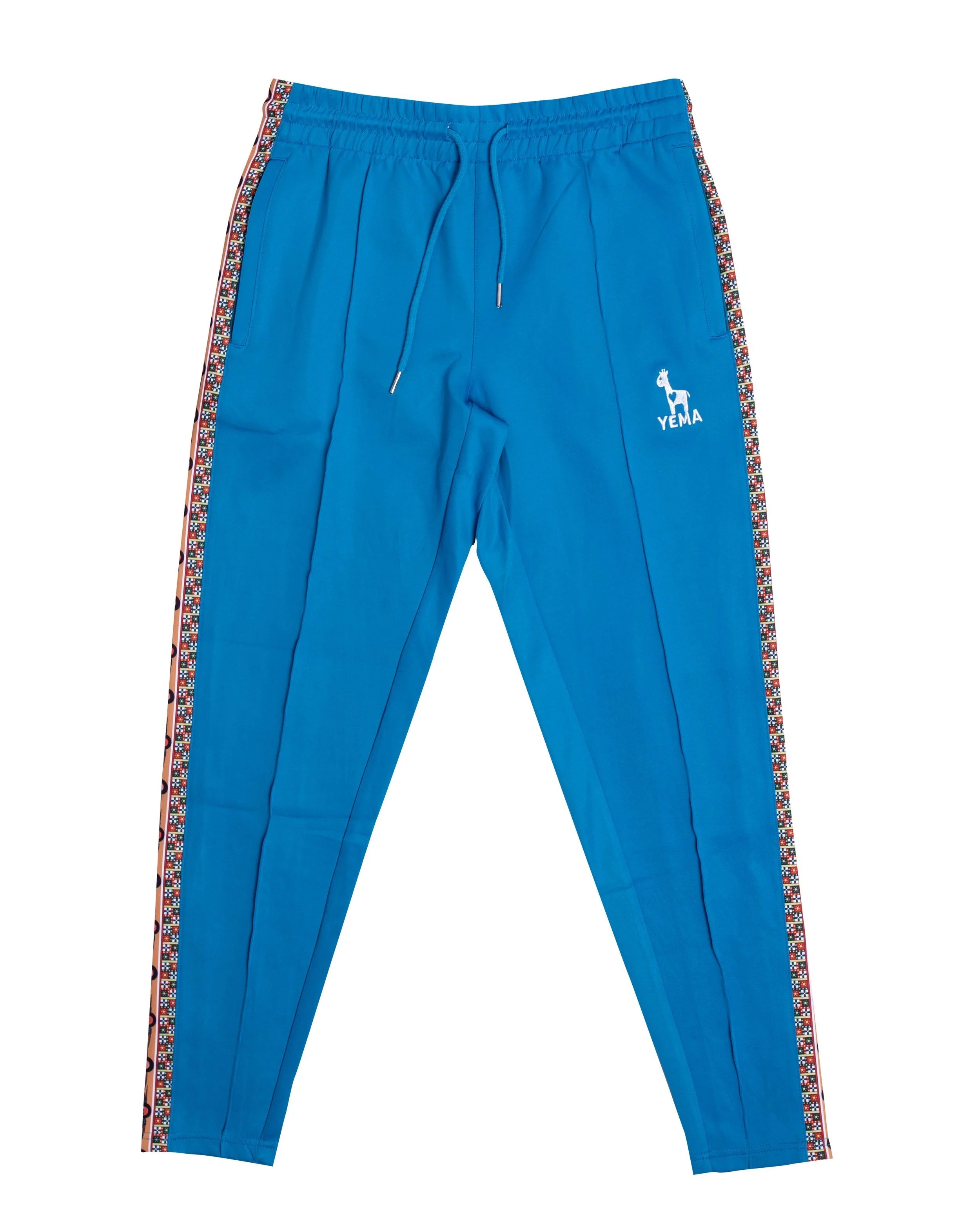 YEMA Classic track pants in Kibera Blue featuring 17th century Abyssinian angels motif