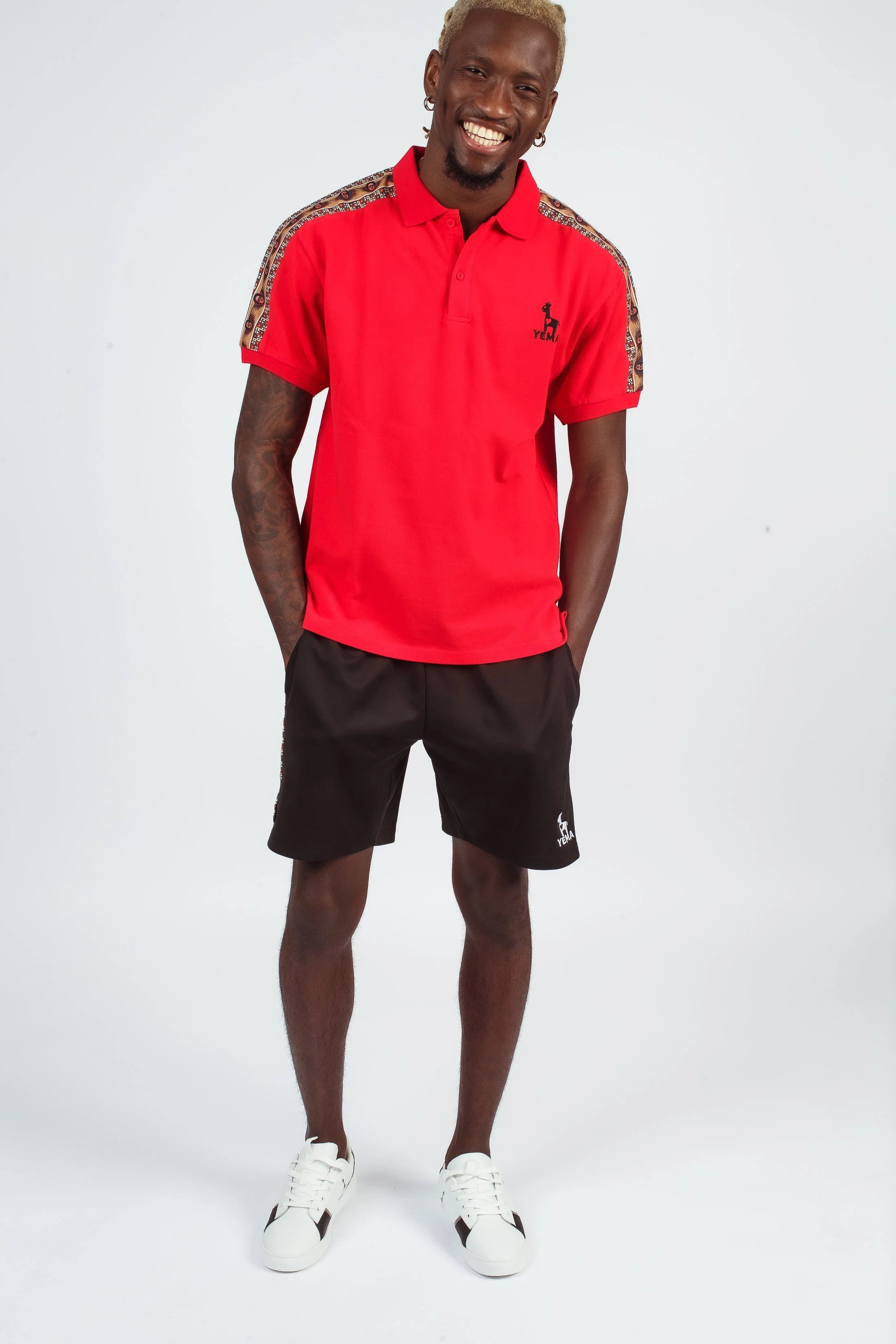 YEMA Classic track shorts featuring 17th century Abyssinian angels motif and double metallic buttons