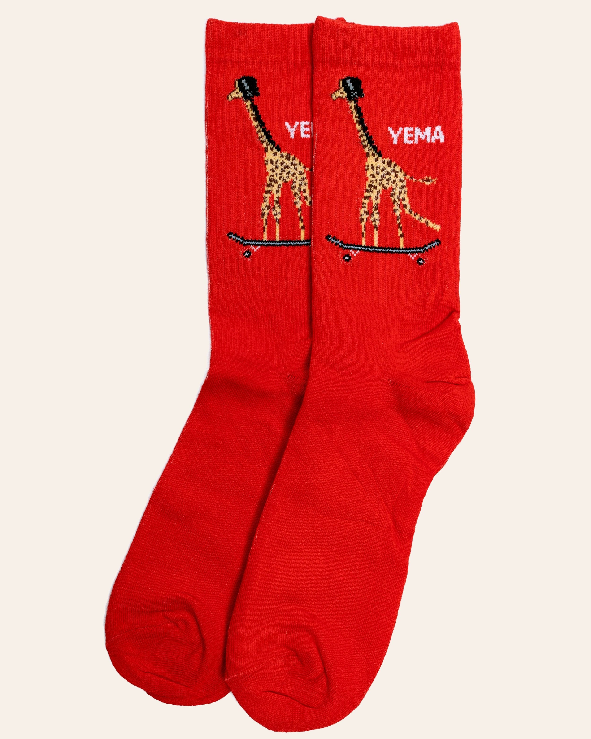YEMA giraffe skating socks in Lali Red with iconic giraffe on skateboard graphic