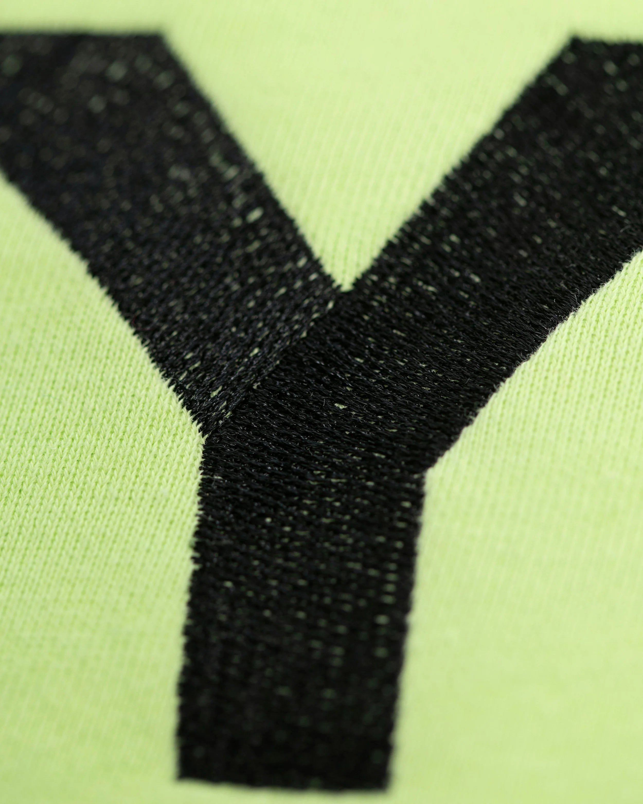 Close-up of Good Joyful Human hoodie with skating giraffe and YEMA sleeve accent