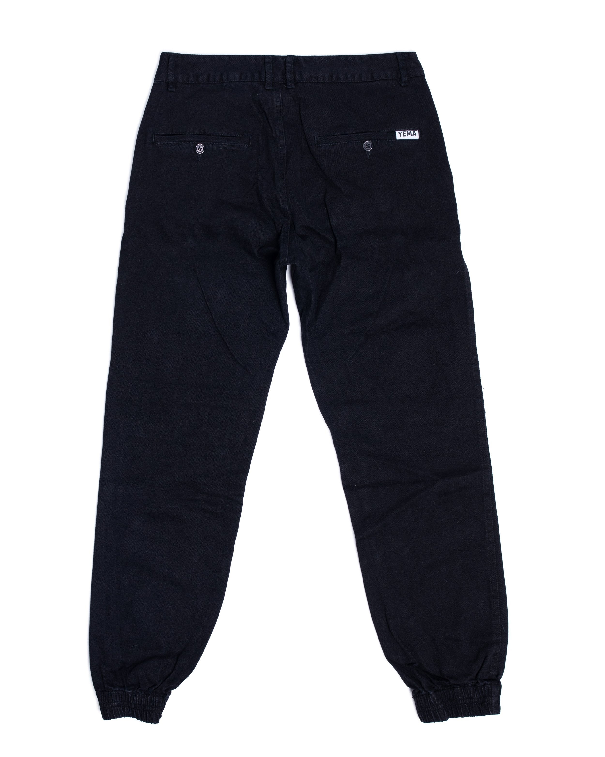 Slim fit jogger pants showing cotton twill construction and cultural design details