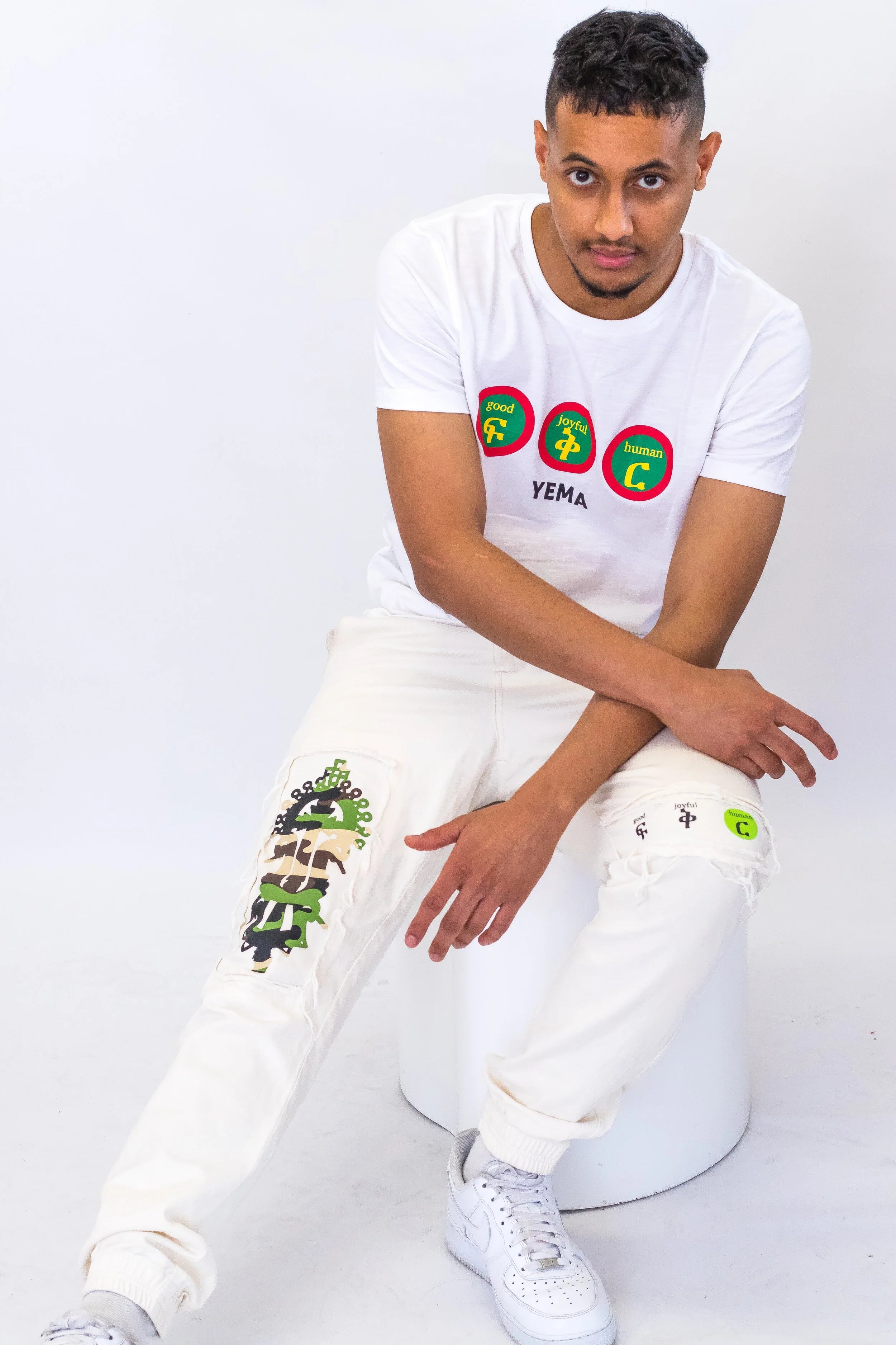 YEMA GJH Joggers in Lalibela featuring distressed detailing and Ethiopian heritage motifs with slim fit