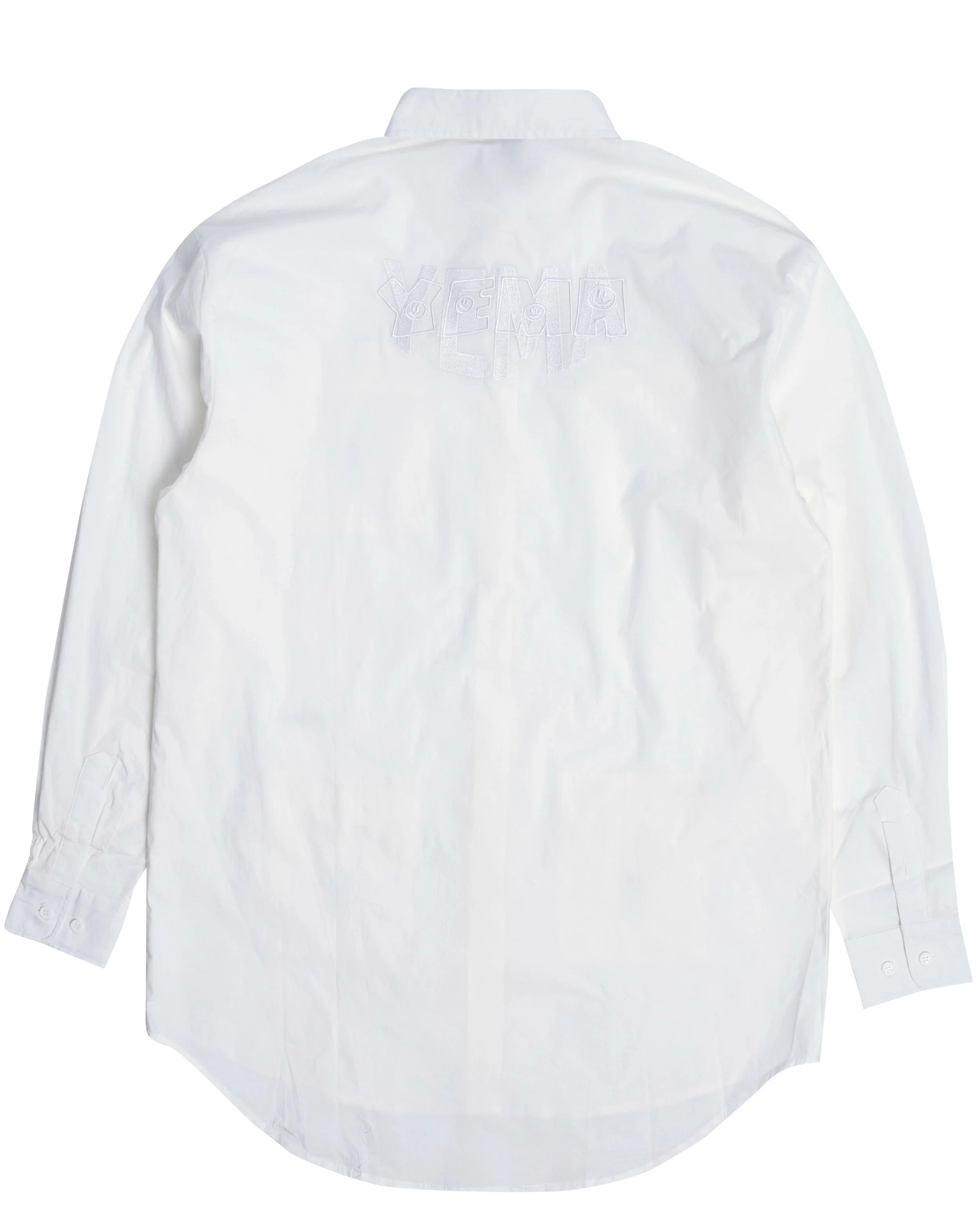 Back view of heritage dress displaying YEMA on YEMA smiling double embroidery