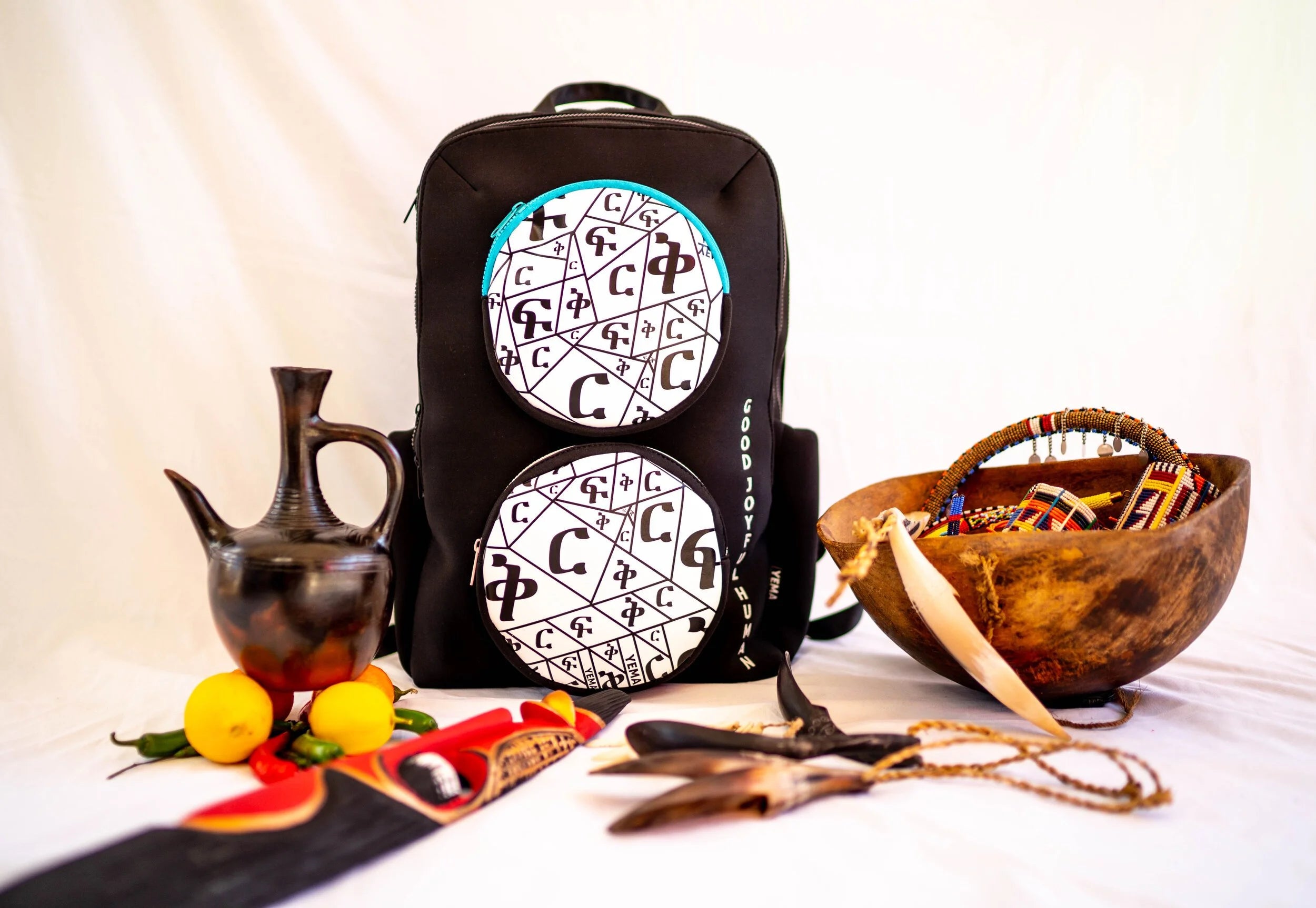 Front view of YEMA HY Lux backpack displaying circle pocket and heritage design elements