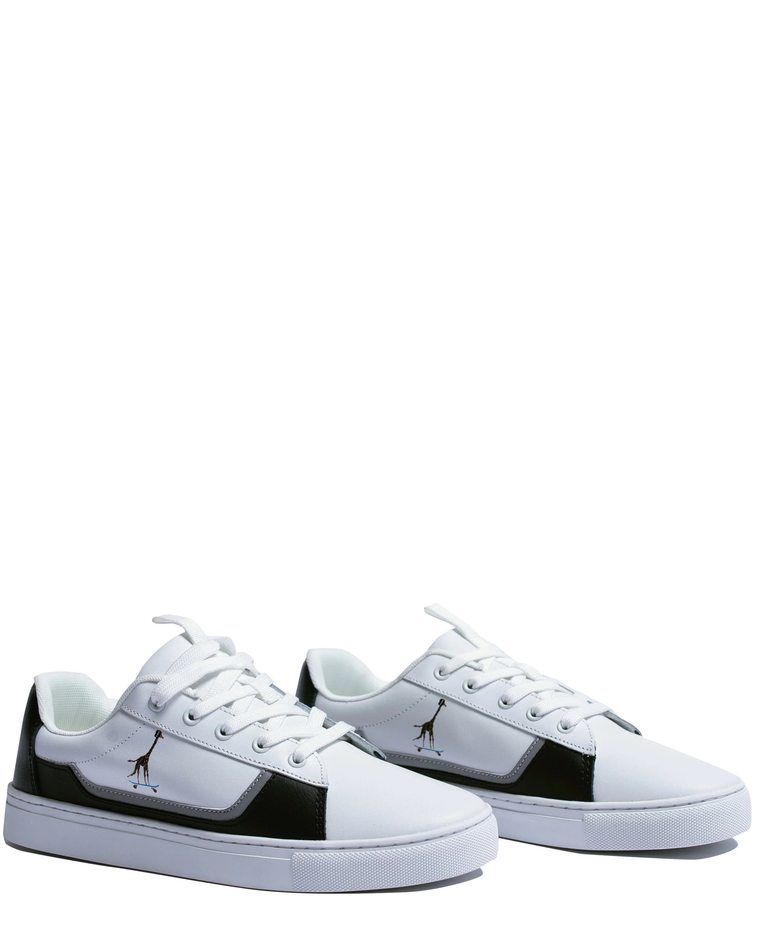 Side view of white leather sneakers showing tumbled leather skating ring and reflective giraffe detail