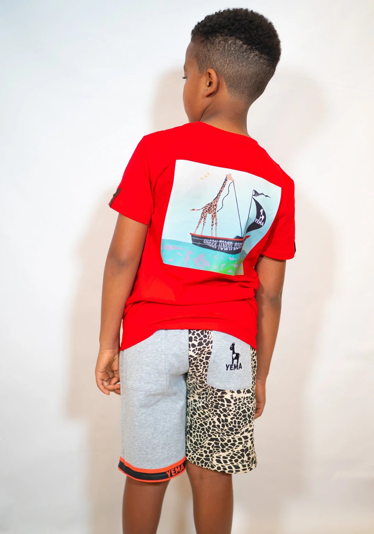 Child wearing Lali Red Captain Giraffe tee showing cozy fit and bold heritage design