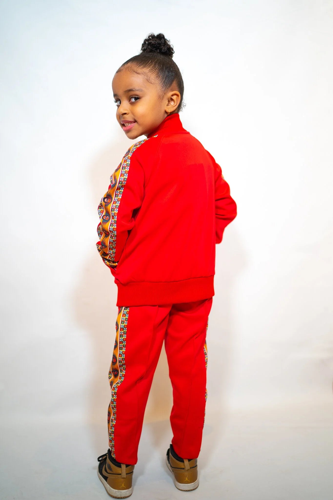 YEMA Kids Classic Track Jacket in Lali Red featuring 17th-century Abyssinian angel motif and full zip