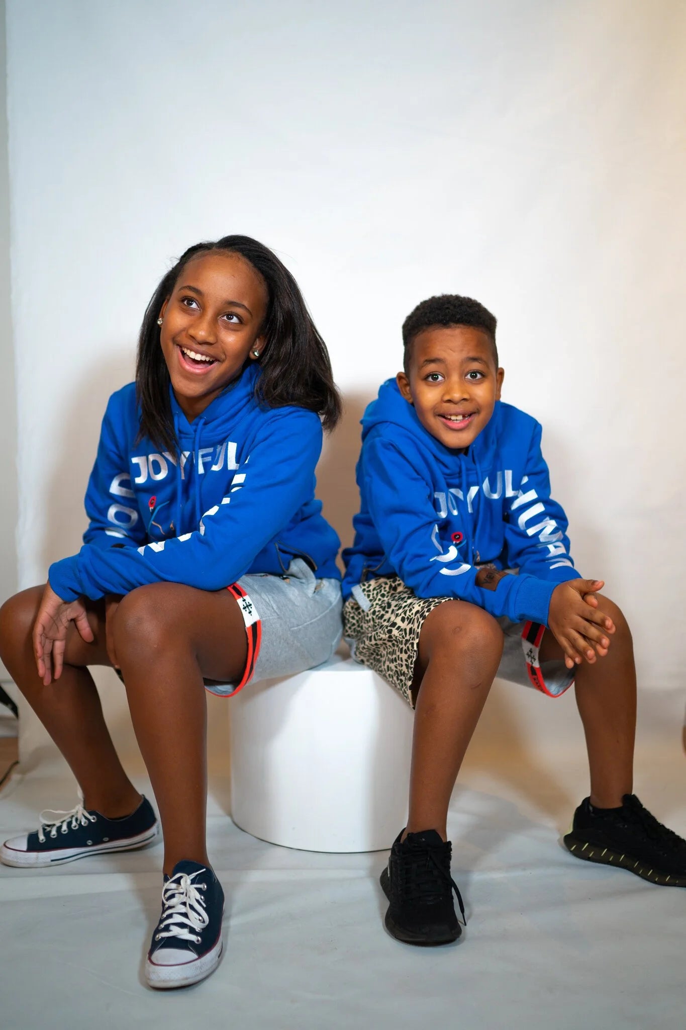 Kids' heritage hoodie with GJH philosophy, terry cotton construction, and Kibera Blue colorway