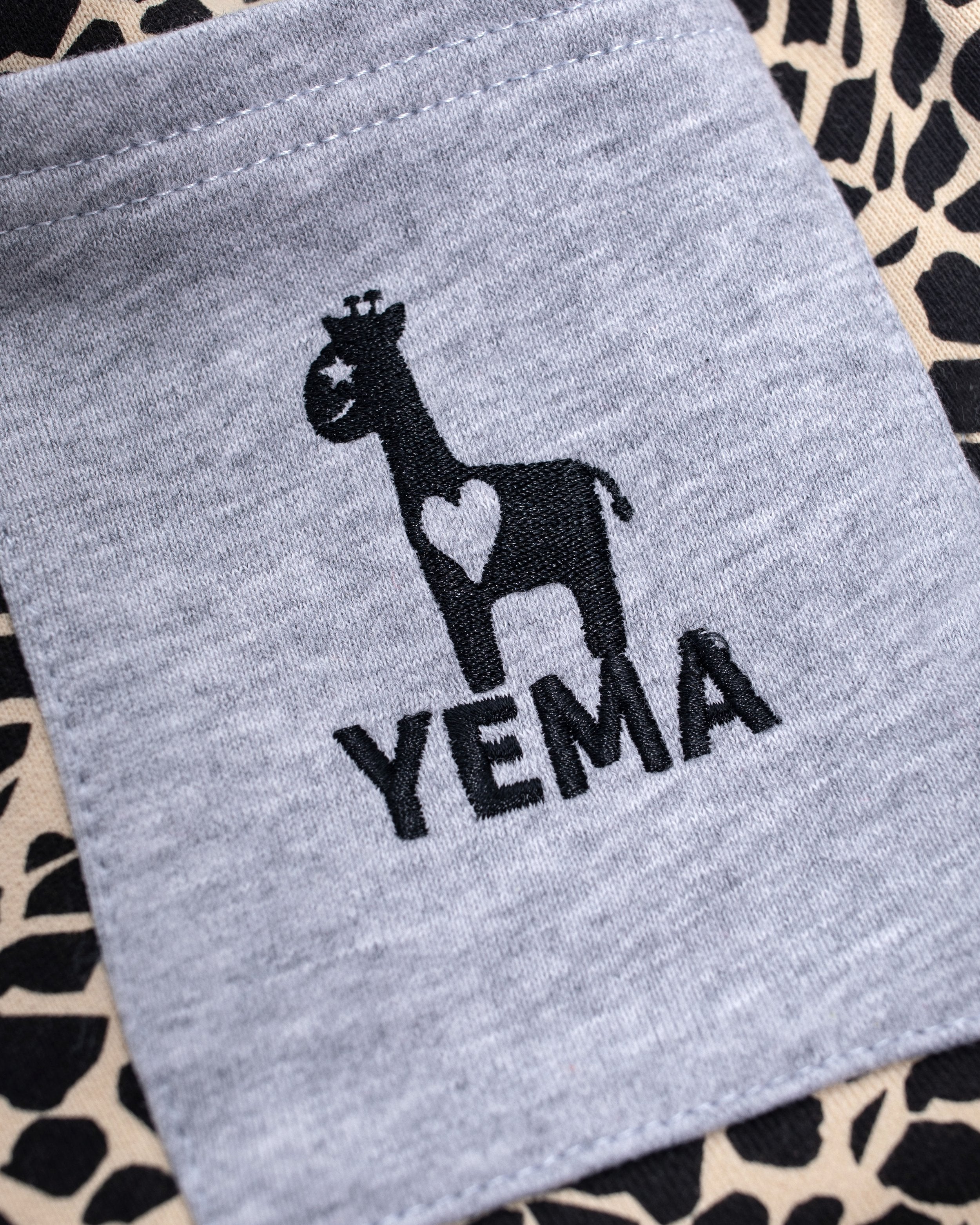 Kids' heritage shorts with YEMA skating giraffe and 100% cotton terry for active play