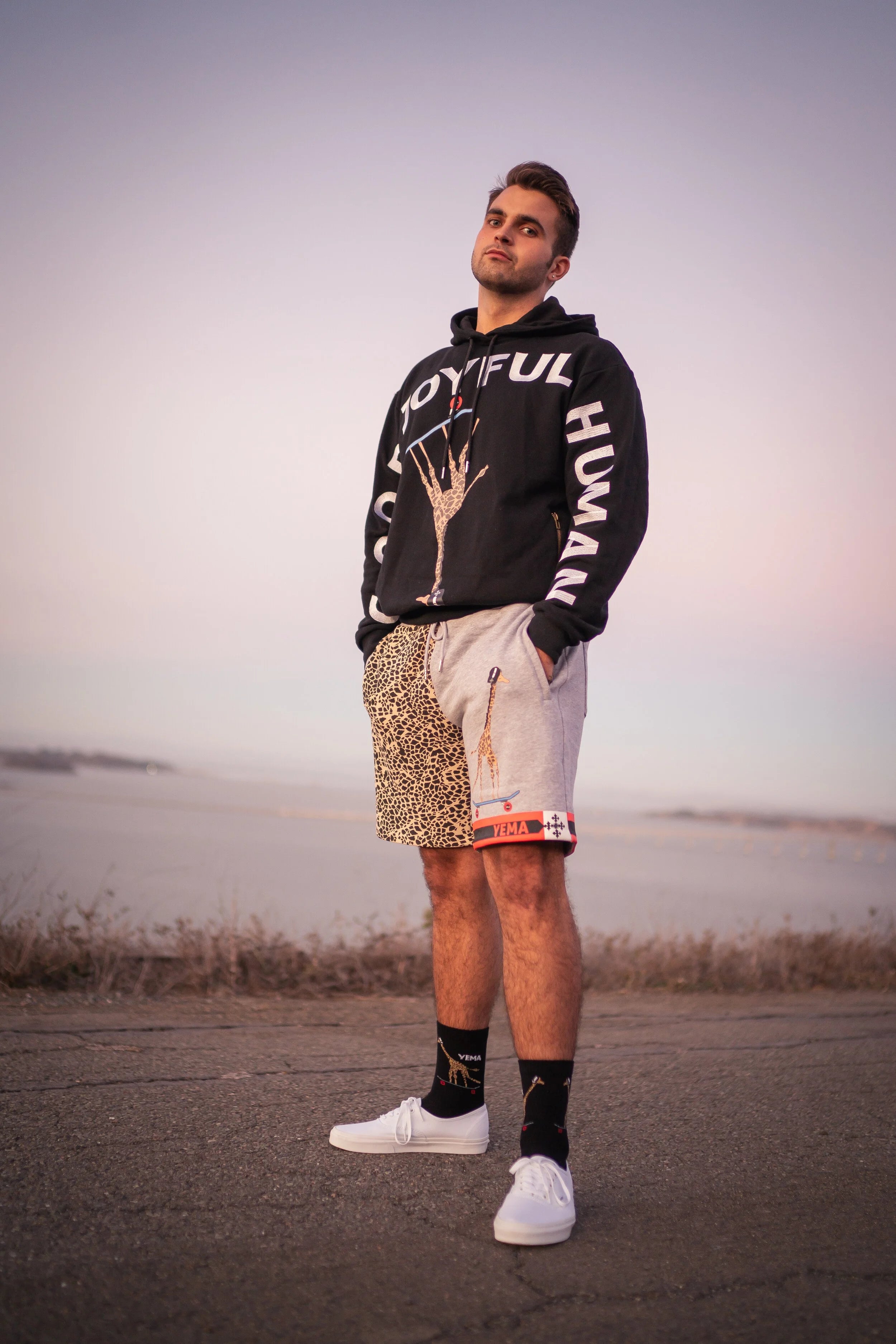 Model wearing YEMA skating shorts with Ethiopian heritage design elements