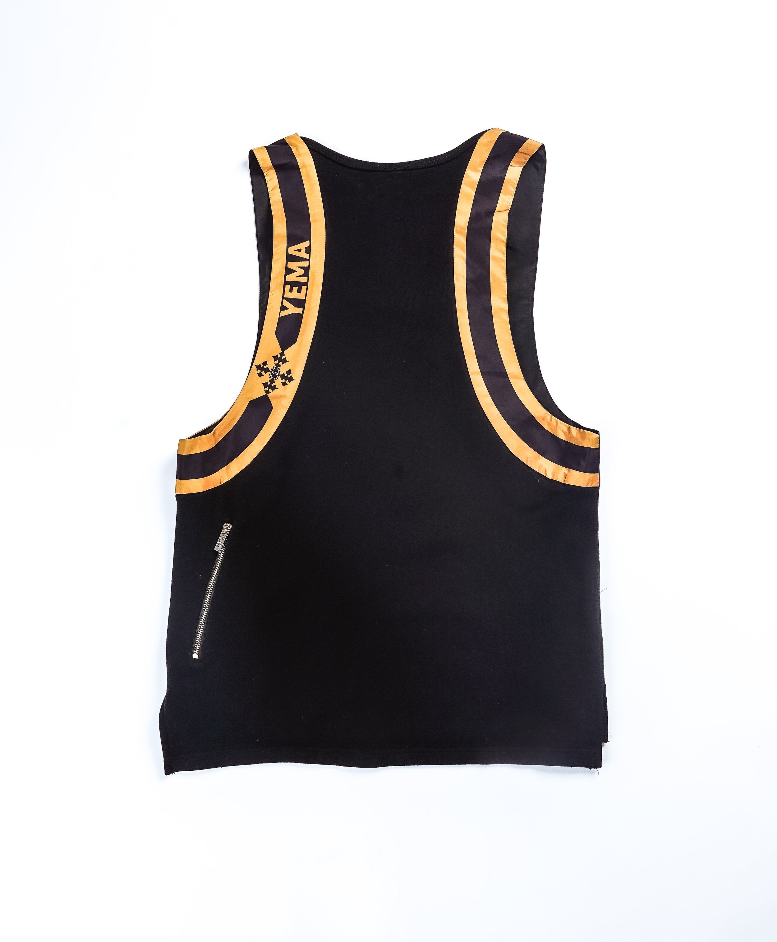 YEMA Addis Black tank top with functional front and back zipper pockets and heritage giraffe motif