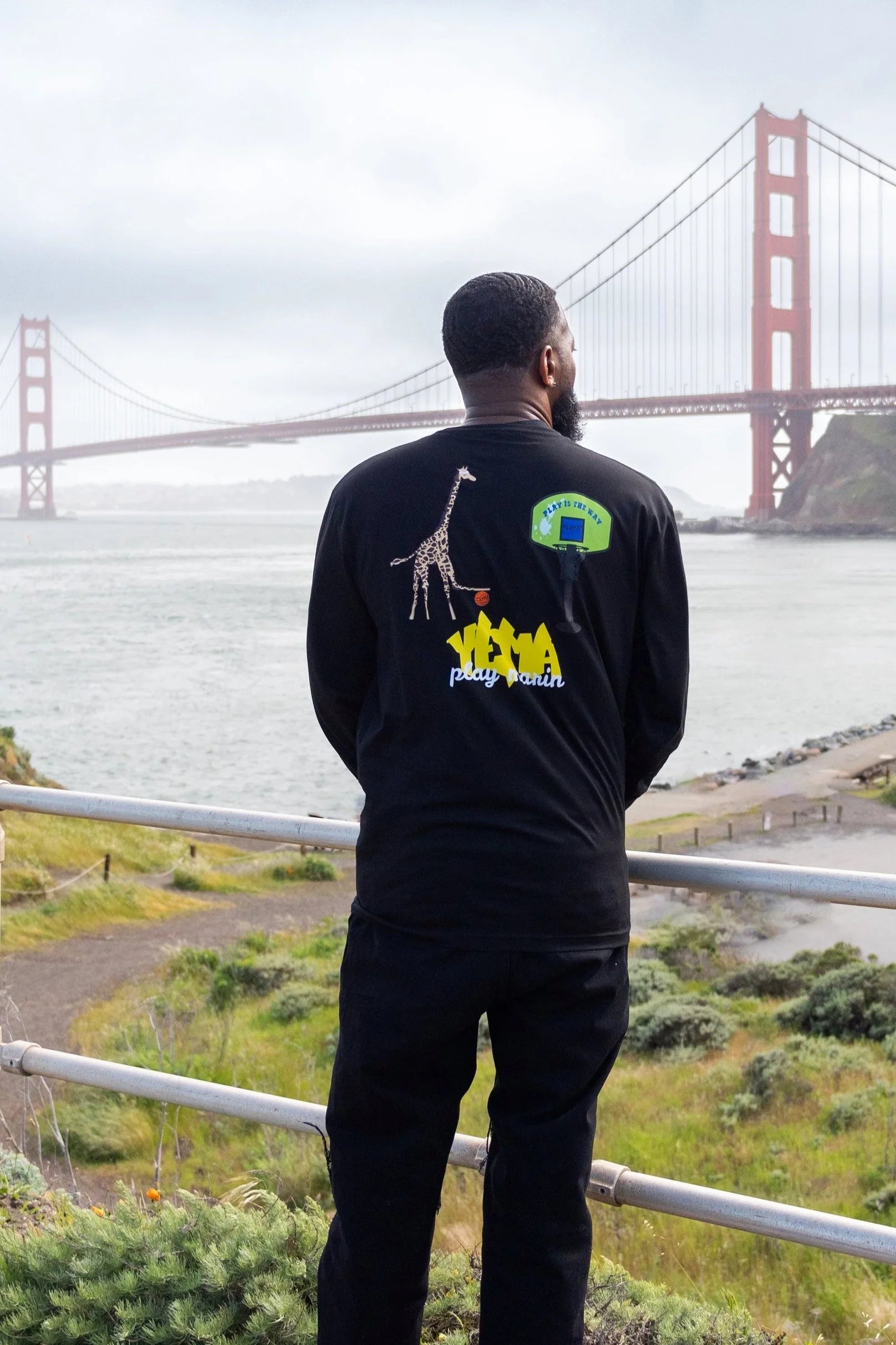 Model wearing YEMA x Play Marin long sleeve tee with heritage-inspired graphic